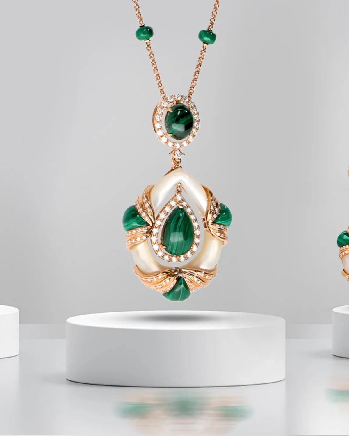 An emerald and rose gold suite by TEJORI Gems